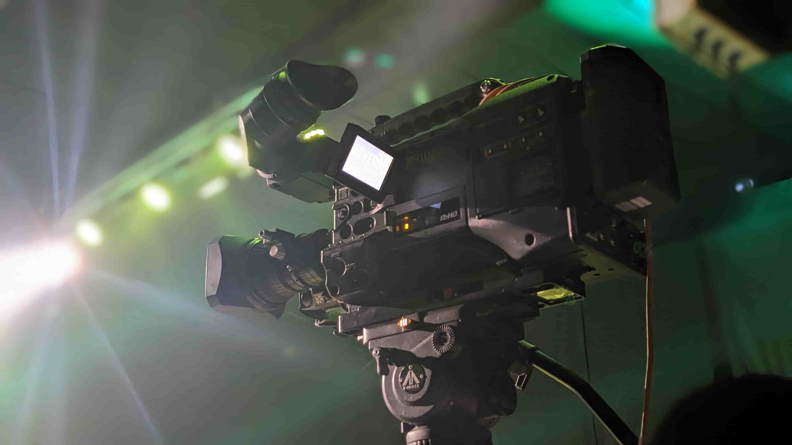 Stadium broadcast camera covering a professional football match for live television coverage